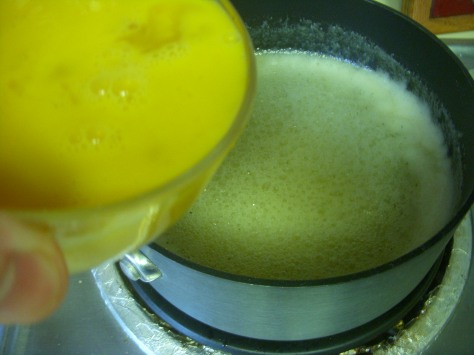 ...beat the eggs and then gradually add them to the mixture, stirring rapidly to keep eggy clumps from happening.
